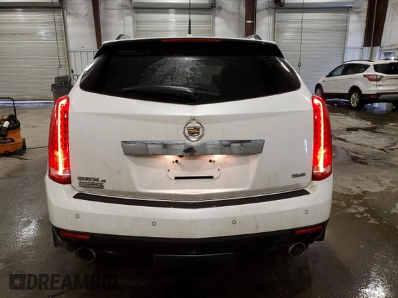 2014 Cadillac SRX Premium Collection z VIN 3GYFNGE36ES581361, wystawiony jako Copart lot #88540815 z przebiegiem 137 047 mil mil oraz Nie do naprawy. Historia ofert i sprzedaży dostępna na DreamBid. Obrazek 6.