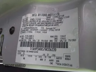 2007 Ford Focus S z VIN 1FAHP34N57W326220, wystawiony jako IAAI lot #42123072 z przebiegiem Nie podano mil oraz . Historia ofert i sprzedaży dostępna na DreamBid. Obrazek 9.