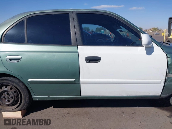 2005 Hyundai Accent GLS with VIN KMHCG45C95U620716, listed as a IAAI auction lot 41740573 with 187,971 mi miles. Bid and sale history available at carsss.com. Image 14.