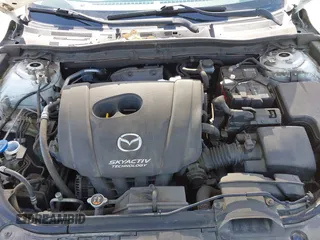 2015 Mazda 3 i SV with VIN JM1BM1T71F1218642, listed as a IAAI auction lot 42142795 with 134,143 mi miles. Bid and sale history available at carsss.com. Image 10.