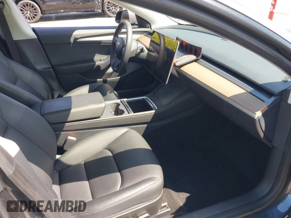 2023 Tesla Model 3 Long Range with VIN 5YJ3E1EB4PF635328, listed as a IAAI auction lot 41978099 with 32,747 mi miles and . Bid and sale history available at DreamBid. Image 5.