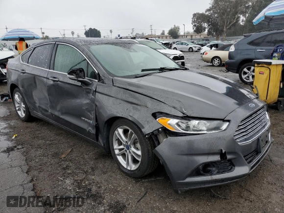 2016 Ford Fusion Titanium Hybrid z VIN 3FA6P0RU5GR356987, wystawiony jako Copart lot #48211775 z przebiegiem 145 192 mil mil oraz Szkoda całkowita • Salvage title. Historia ofert i sprzedaży dostępna na DreamBid. Obrazek 4.
