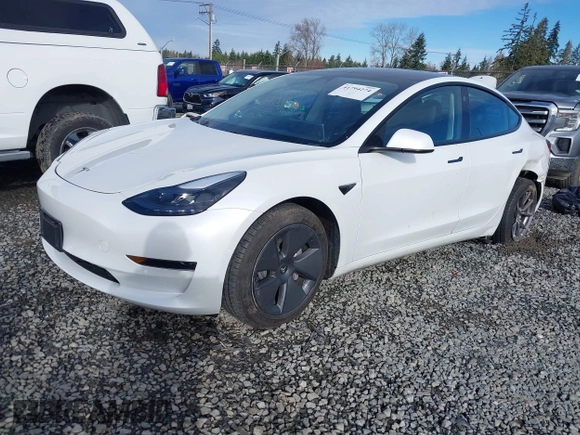 2021 Tesla Model 3 Standard Range Plus z VIN 5YJ3E1EAXMF871730, wystawiony jako IAAI lot #41794274 z przebiegiem 18 791 mil mil oraz . Historia ofert i sprzedaży dostępna na DreamBid. Obrazek 2.