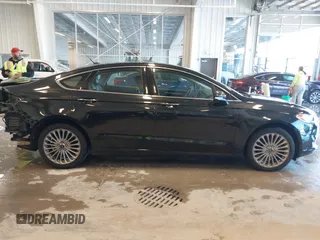 2014 Ford Fusion Titanium with VIN 3FA6P0K93ER115805, listed as a IAAI auction lot 41009602 with 136,021 mi miles. Bid and sale history available at carsss.com. Image 14.