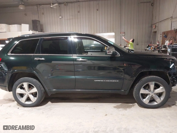 2014 Jeep Grand Cherokee Overland with VIN 1C4RJFCGXEC162109, listed as a IAAI auction lot 41943979 with 147,788 mi miles. Bid and sale history available at carsss.com. Image 14.