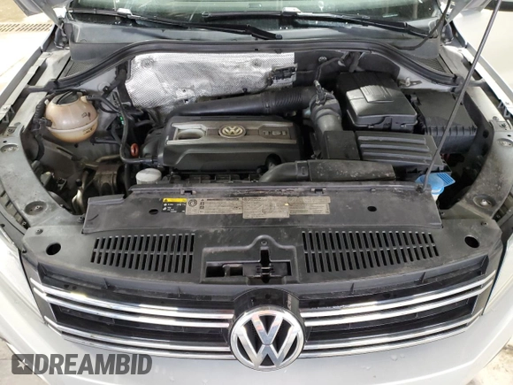 2013 Volkswagen Tiguan SE z VIN WVGBV3AX1DW579506, wystawiony jako Copart lot #52719575 z przebiegiem 163 471 mil mil oraz Szkoda całkowita • Salvage title. Historia ofert i sprzedaży dostępna na DreamBid. Obrazek 13.