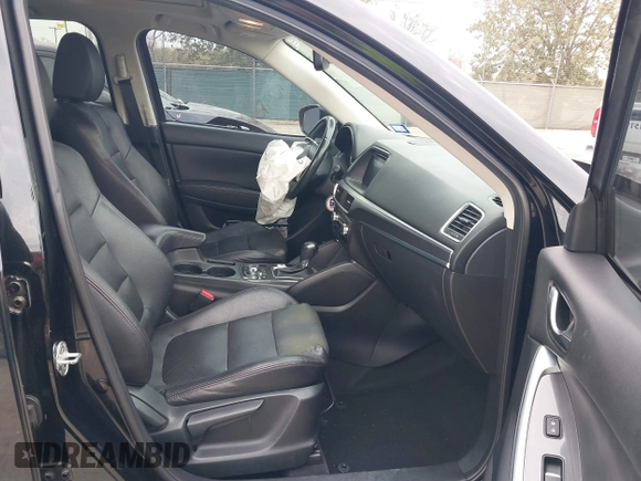 2016 Mazda CX-5 Grand Touring with VIN JM3KE2DY0G0651300, listed as a IAAI auction lot 41678833 with 98,790 mi miles. Bid and sale history available at carsss.com. Image 5.