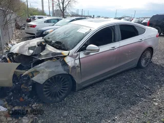 2016 Ford Fusion Titanium with VIN 3FA6P0K95GR400718, listed as a IAAI auction lot 41957913 with 133,037 mi miles. Bid and sale history available at carsss.com. Image 2.