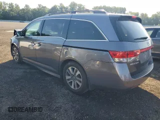 2014 Honda Odyssey Touring with VIN 5FNRL5H94EB116891, listed as a Copart auction lot 61400725 with 202,972 mi miles and Salvage title. Bid and sale history available at DreamBid. Image 2.