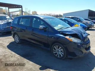 2014 Mazda 5 Sport with VIN JM1CW2BLXE0175975, listed as a IAAI auction lot 40278614 with 102,430 mi miles and . Bid and sale history available at DreamBid. Image 1.