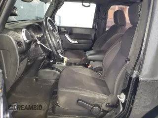 2013 Jeep Wrangler Rubicon with VIN 1C4BJWCG1DL584611, listed as a Copart auction lot 71536944 with 142,975 mi miles and Salvage title. Bid and sale history available at DreamBid. Image 7.
