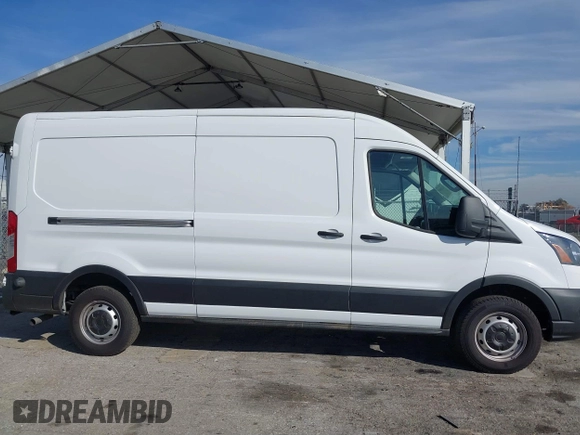 2023 Ford Transit Cargo with VIN 1FTBR1C85PKC08945, listed as a IAAI auction lot 41385685 with 5,577 mi miles and . Bid and sale history available at DreamBid. Image 14.