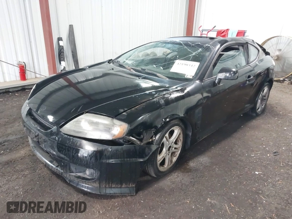 2005 Hyundai Tiburon GT z VIN KMHHN65F45U184777, wystawiony jako IAAI lot #42190342 z przebiegiem 213 013 mil mil oraz . Historia ofert i sprzedaży dostępna na DreamBid. Obrazek 2.