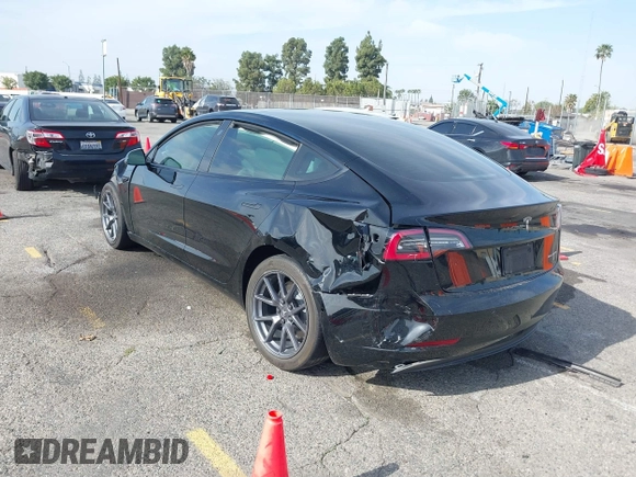 2022 Tesla Model 3 Long Range with VIN 5YJ3E1EB6NF233131, listed as a IAAI auction lot 41819409 with 38,308 mi miles and . Bid and sale history available at DreamBid. Image 3.