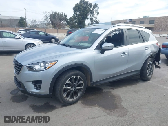 2016 Mazda CX-5 Grand Touring with VIN JM3KE2DY9G0723921, listed as a IAAI auction lot 41681522 with 83,893 mi miles. Bid and sale history available at carsss.com. Image 17.