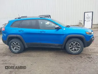 2021 Jeep Cherokee Trailhawk with VIN 1C4PJMBXXMD173102, listed as a IAAI auction lot 42205402 with 57,321 mi miles and . Bid and sale history available at DreamBid. Image 14.