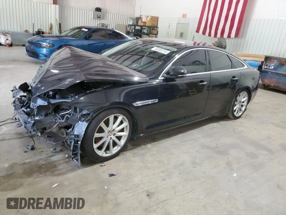 2014 Jaguar XJ with VIN SAJWA1CZ0E8V61168, listed as a Copart auction lot 54383215 with 137,724 mi miles and Salvage Title. Bid and sale history available at DreamBid. Image 1.
