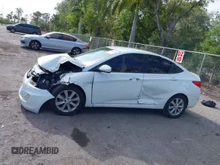 2014 Hyundai Accent GLS with VIN KMHCU4AE8EU608539, listed as a IAAI auction lot 41946784 with 106,709 mi miles and . Bid and sale history available at carsss.com. Image 13.