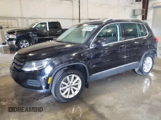 2017 Volkswagen Tiguan Wolfsburg Edition with VIN WVGSV7AX7HK017565, listed as a Copart auction lot 58843905 with 122,474 mi miles and Salvage title. Bid and sale history available at DreamBid. Image 1.