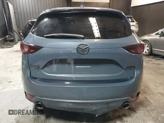 2021 Mazda CX-5 Touring with VIN JM3KFBCM5M0365725, listed as a IAAI auction lot 41411763 with 77,504 mi miles. Bid and sale history available at carsss.com. Image 17.