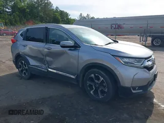 2018 Honda CR-V Touring with VIN 7FARW1H99JE001458, listed as a IAAI auction lot 42187679 with 101,987 mi miles and . Bid and sale history available at DreamBid. Image 1.