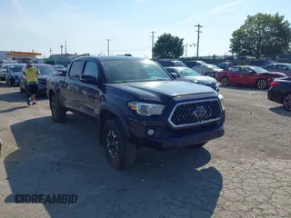 2018 Toyota Tacoma SR5 with VIN 3TMDZ5BN1JM049882, listed as a IAAI auction lot 42589217 with 227,655 mi miles and . Bid and sale history available at DreamBid. Image 1.