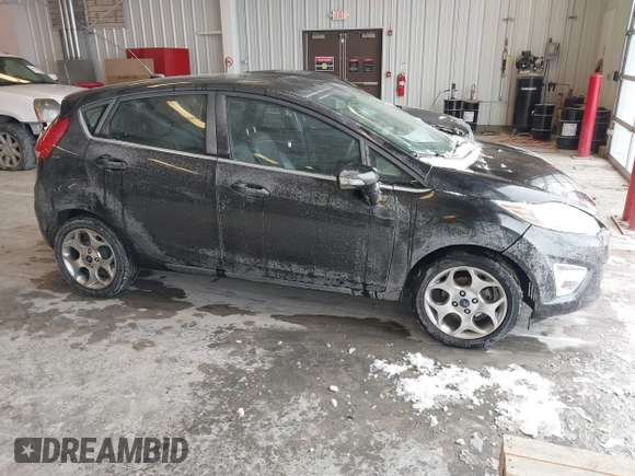 2011 Ford Fiesta SES with VIN 3FADP4FJ7BM196559, listed as a IAAI auction lot 41527976 with 65,861 mi miles. Bid and sale history available at carsss.com. Image 1.