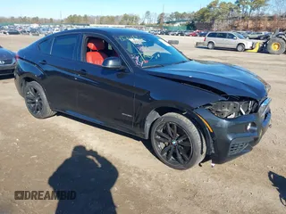 2019 BMW X6 xDrive50i with VIN 5UXKU6C59KLP60659, listed as a IAAI auction lot 41741966 with 71,487 mi miles. Bid and sale history available at carsss.com. Image 1.
