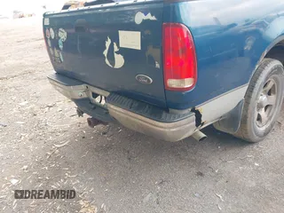 1999 Ford F-150 XL with VIN 1FTRX17L0XNC07560, listed as a IAAI auction lot 42183858 with Not provided miles and . Bid and sale history available at DreamBid. Image 6.