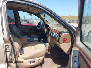 1999 Jeep Grand Cherokee Limited with VIN 1J4GW68N2XC654713, listed as a IAAI auction lot 42115829 with 195,988 mi miles. Bid and sale history available at carsss.com. Image 5.