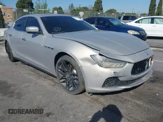 2014 Maserati Ghibli S Q4 z VIN ZAM57RTA8E1095303, wystawiony jako IAAI lot #41600587 z przebiegiem 98 215 mil mil oraz . Historia ofert i sprzedaży dostępna na DreamBid. Obrazek 1.