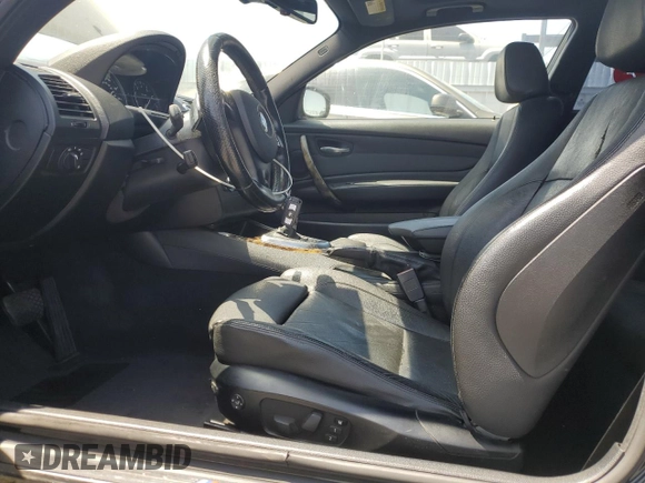 2011 BMW 1 Series 135i with VIN WBAUC9C59BVM10528, listed as a Copart auction lot 61499025 with 160,557 mi miles and Salvage title. Bid and sale history available at DreamBid. Image 7.
