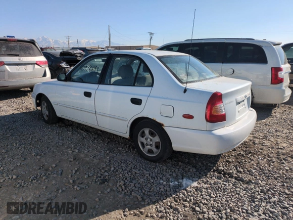 2000 Hyundai Accent z VIN KMHCG45G0YU084004, wystawiony jako Copart lot #42980585 z przebiegiem 167 545 mil mil oraz Czysty tytuł • Clean title. Historia ofert i sprzedaży dostępna na DreamBid. Obrazek 2.