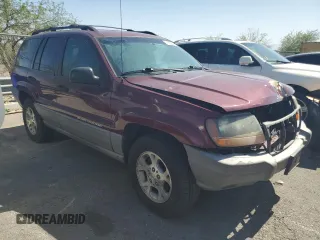 2000 Jeep Grand Cherokee Laredo with VIN 1J4G248S1YC407769, listed as a Copart auction lot 61653545 with 188,882 mi miles and Salvage title. Bid and sale history available at DreamBid. Image 4.