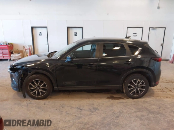2018 Mazda CX-5 Touring with VIN JM3KFBCM9J0437490, listed as a IAAI auction lot 42006998 with 176,959 mi miles. Bid and sale history available at carsss.com. Image 14.