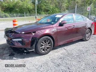 2019 Kia Optima LX z VIN 5XXGT4L38KG320364, wystawiony jako IAAI lot #42150783 z przebiegiem 103 089 mil mil oraz . Historia ofert i sprzedaży dostępna na DreamBid. Obrazek 2.