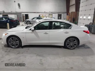 2015 Infiniti Q50 z VIN JN1BV7ARXFM409367, wystawiony jako IAAI lot #41912056 z przebiegiem 126 382 mil mil oraz . Historia ofert i sprzedaży dostępna na DreamBid. Obrazek 14.
