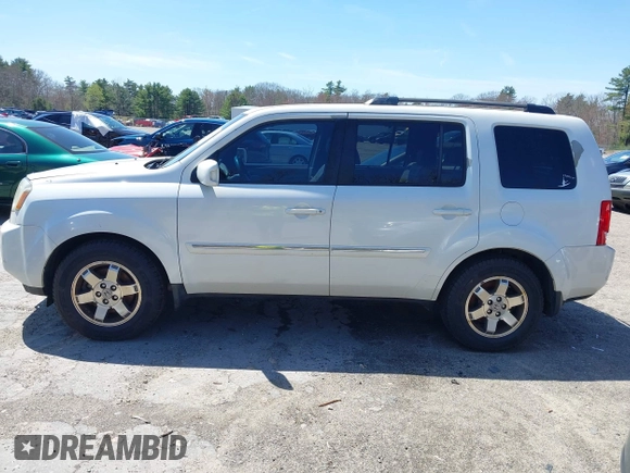 2011 Honda Pilot Touring with VIN 5FNYF4H98BB087713, listed as a IAAI auction lot 42132764 with 250,507 mi miles. Bid and sale history available at carsss.com. Image 15.