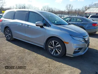 2018 Honda Odyssey Elite z VIN 5FNRL6H91JB070355, wystawiony jako IAAI lot #41975916 z przebiegiem 147 022 mil mil oraz . Historia ofert i sprzedaży dostępna na DreamBid. Obrazek 1.