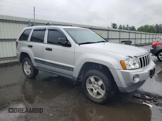 2005 Jeep Grand Cherokee Laredo with VIN 1J4GR48K55C719634, listed as a Copart auction lot 61809195 with 141,316 mi miles and Salvage title. Bid and sale history available at DreamBid. Image 4.