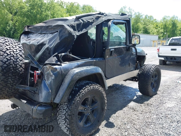 2003 Jeep Wrangler Sport z VIN 1J4FA49S53P317779, wystawiony jako IAAI lot #42388780 z przebiegiem Nie podano mil oraz . Historia ofert i sprzedaży dostępna na DreamBid. Obrazek 4.
