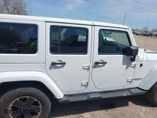 2012 Jeep Wrangler Unlimited Sahara with VIN 1C4HJWEG3CL254944, listed as a IAAI auction lot 42060981 with 172,358 mi miles. Bid and sale history available at carsss.com. Image 13.