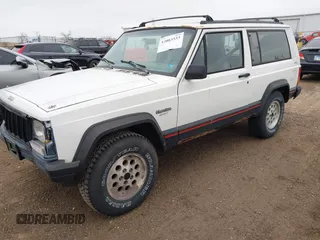 1996 Jeep Cherokee Sport with VIN 1J4FJ67S4TL224743, listed as a IAAI auction lot 42083533 with 253,847 mi miles. Bid and sale history available at carsss.com. Image 2.