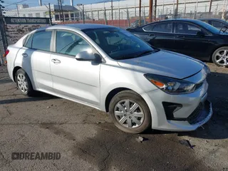 2023 Kia Rio LX with VIN 3KPA24AD1PE599290, listed as a IAAI auction lot 41023283 with 10,027 mi miles and . Bid and sale history available at DreamBid. Image 1.