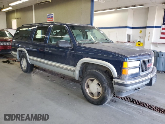 1999 GMC Suburban z VIN 3GKFK16R5XG525338, wystawiony jako Copart lot #58920565 z przebiegiem 212 586 mil mil oraz Szkody całkowita. Historia ofert i sprzedaży dostępna na DreamBid. Obrazek 4.