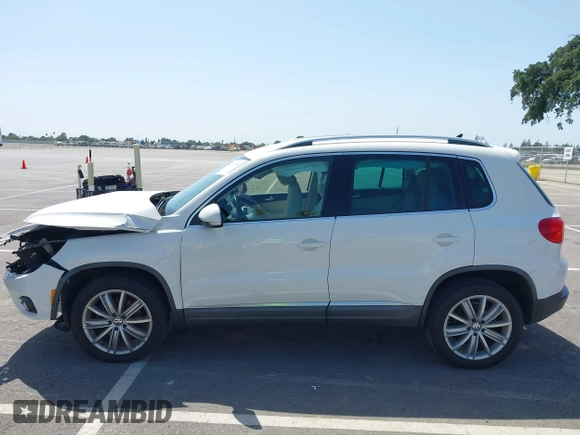 2014 Volkswagen Tiguan SEL with VIN WVGAV3AX9EW512956, listed as a IAAI auction lot 42110002 with 136,034 mi miles and . Bid and sale history available at DreamBid. Image 14.
