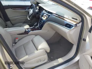 2013 Cadillac XTS Premium z VIN 2G61S5S35D9143656, wystawiony jako IAAI lot #42099511 z przebiegiem 207 055 mil mil oraz . Historia ofert i sprzedaży dostępna na DreamBid. Obrazek 5.