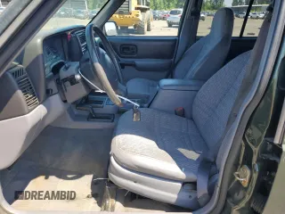 1998 Jeep Cherokee Sport with VIN 1J4FJ68S5WL108020, listed as a Copart auction lot 60150655 with 290,595 mi miles and Salvage title. Bid and sale history available at DreamBid. Image 7.