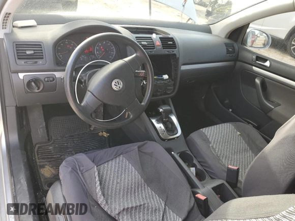 2009 Volkswagen Rabbit S с VIN WVWBA71K29W033350, выставлен на аукционе Copart как лот 84136794 с пробегом 157 632 миль миль и Списание • Salvage title. История ставок и продаж доступна на DreamBid. Изображение 8.