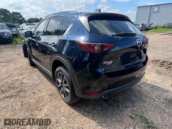 2018 Mazda CX-5 Grand Touring with VIN JM3KFBDMXJ1391984, listed as a Copart auction lot 65138665 with 97,244 mi miles and Clean title. Bid and sale history available at DreamBid. Image 3.